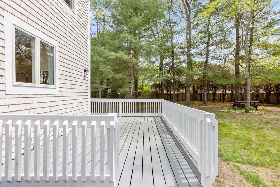 84 Cap'n Lijah's Road Centerville, MA 02632 - Photo 13 of 24 a view of deck with a large trees
