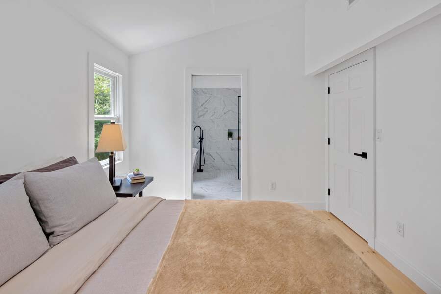 84 Cap'n Lijah's Road Centerville, MA 02632 - Photo 17 of 24 a bedroom with a bed and a lamp