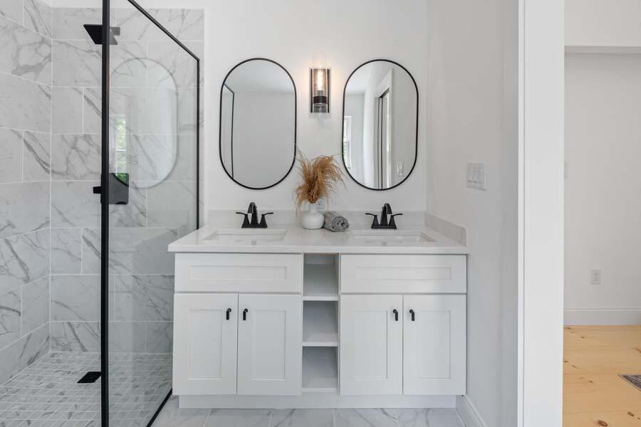 84 Cap'n Lijah's Road Centerville, MA 02632 - Photo 19 of 24 a bathroom with a double vanity sink and a mirror