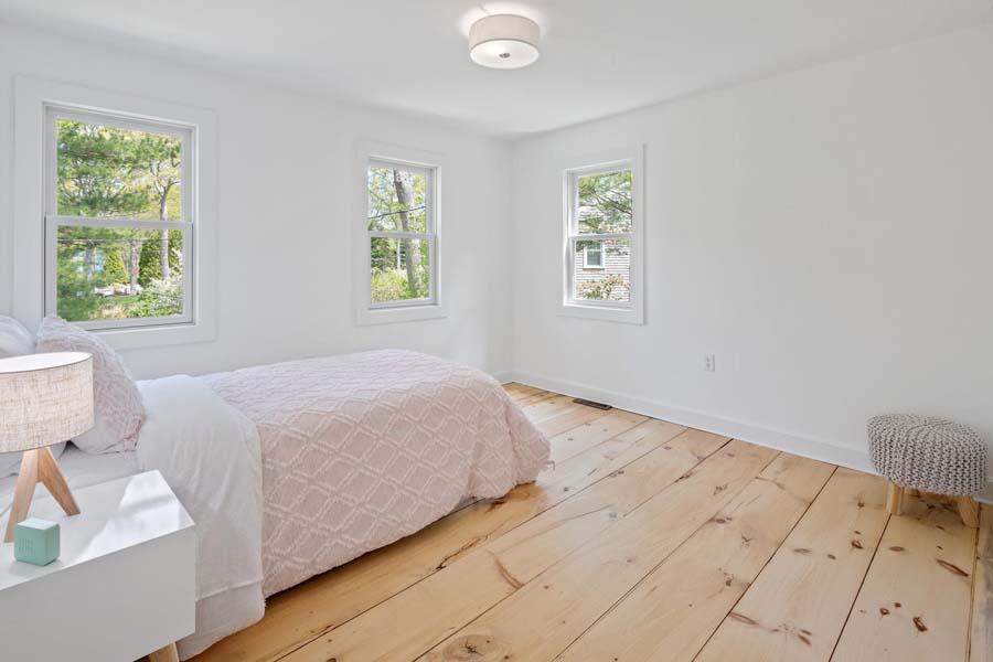84 Cap'n Lijah's Road Centerville, MA 02632 - Photo 20 of 24 a bedroom with a bed and a window