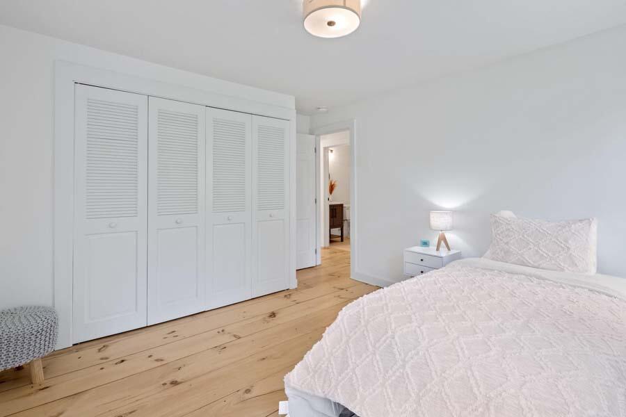 84 Cap'n Lijah's Road Centerville, MA 02632 - Photo 21 of 24 a spacious bedroom with a bed and a dresser