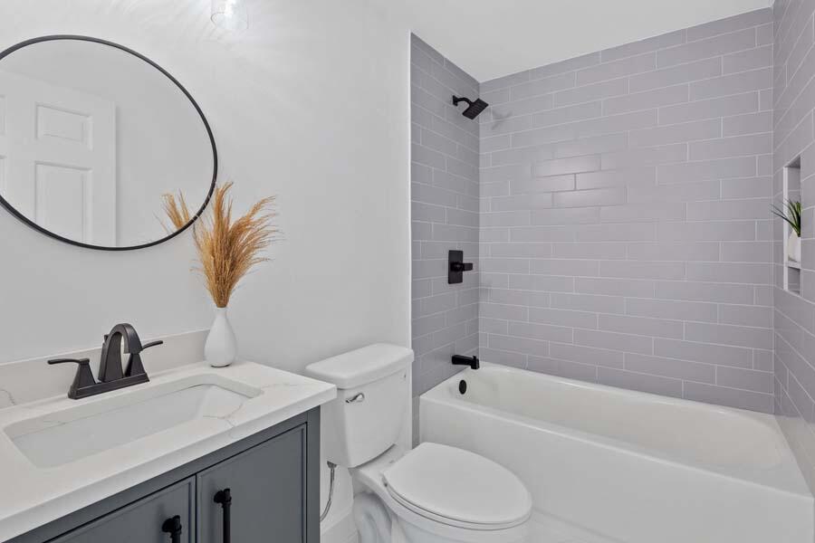 84 Cap'n Lijah's Road Centerville, MA 02632 - Photo 22 of 24 a bathroom with a sink a toilet and a mirror