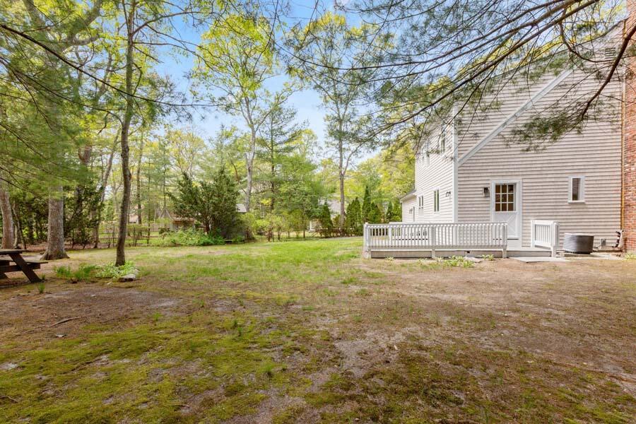 84 Cap'n Lijah's Road Centerville, MA 02632 - Photo 24 of 24 a view of a yard with plants and trees