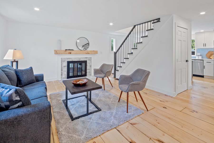 84 Cap'n Lijah's Road Centerville, MA 02632 - Photo 8 of 24 a living room with furniture and a fireplace