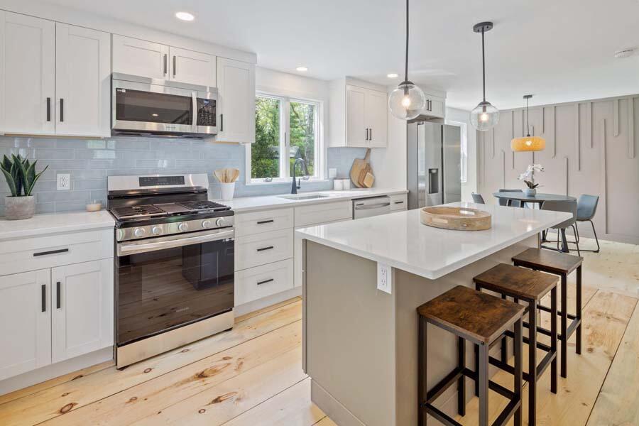 84 Cap'n Lijah's Road Centerville, MA 02632 - Photo 9 of 24 a kitchen with a stove a sink and a microwave