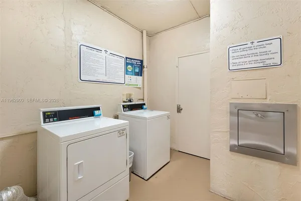 a view of a hallway with wooden floor and entryway