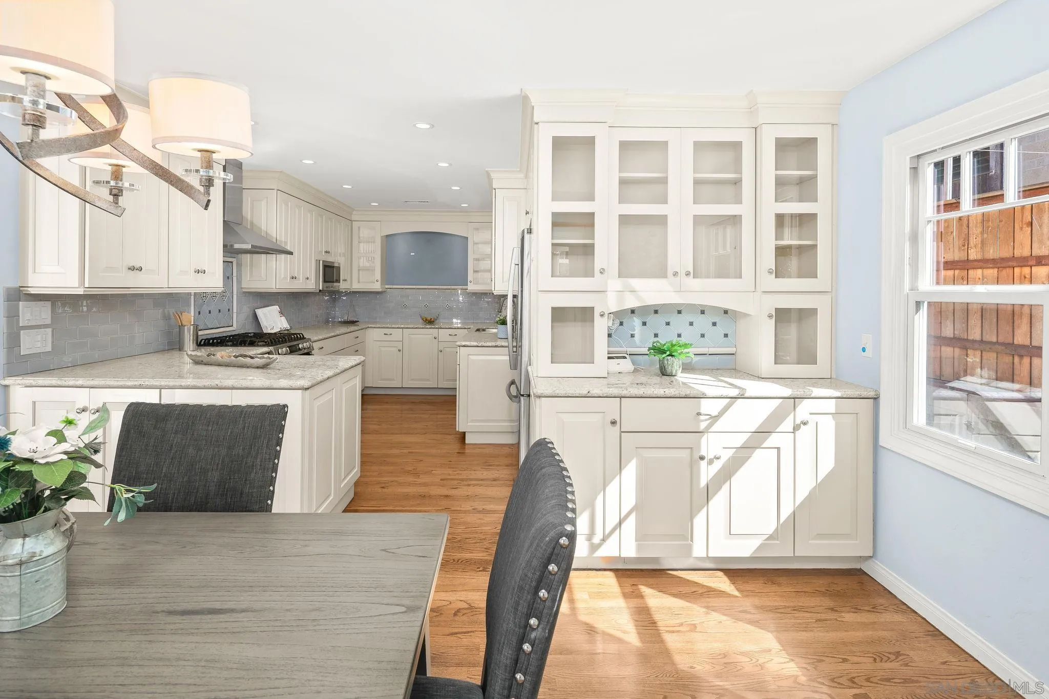 3733 La Cresta Drive San Diego, CA 92107 - Photo 11 of 57 a kitchen with stainless steel appliances granite countertop a stove a sink and a microwave