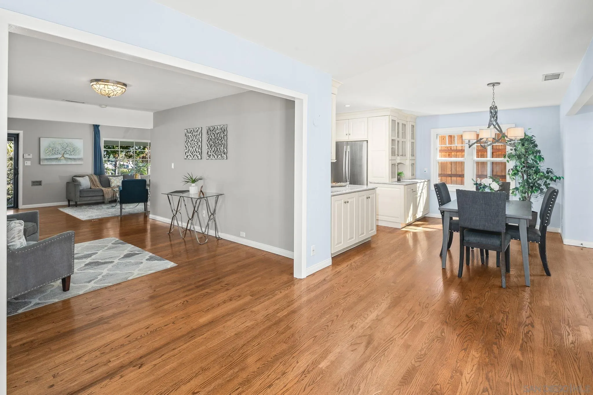 3733 La Cresta Drive San Diego, CA 92107 - Photo 17 of 57 a view of a dining room with furniture and wooden floor