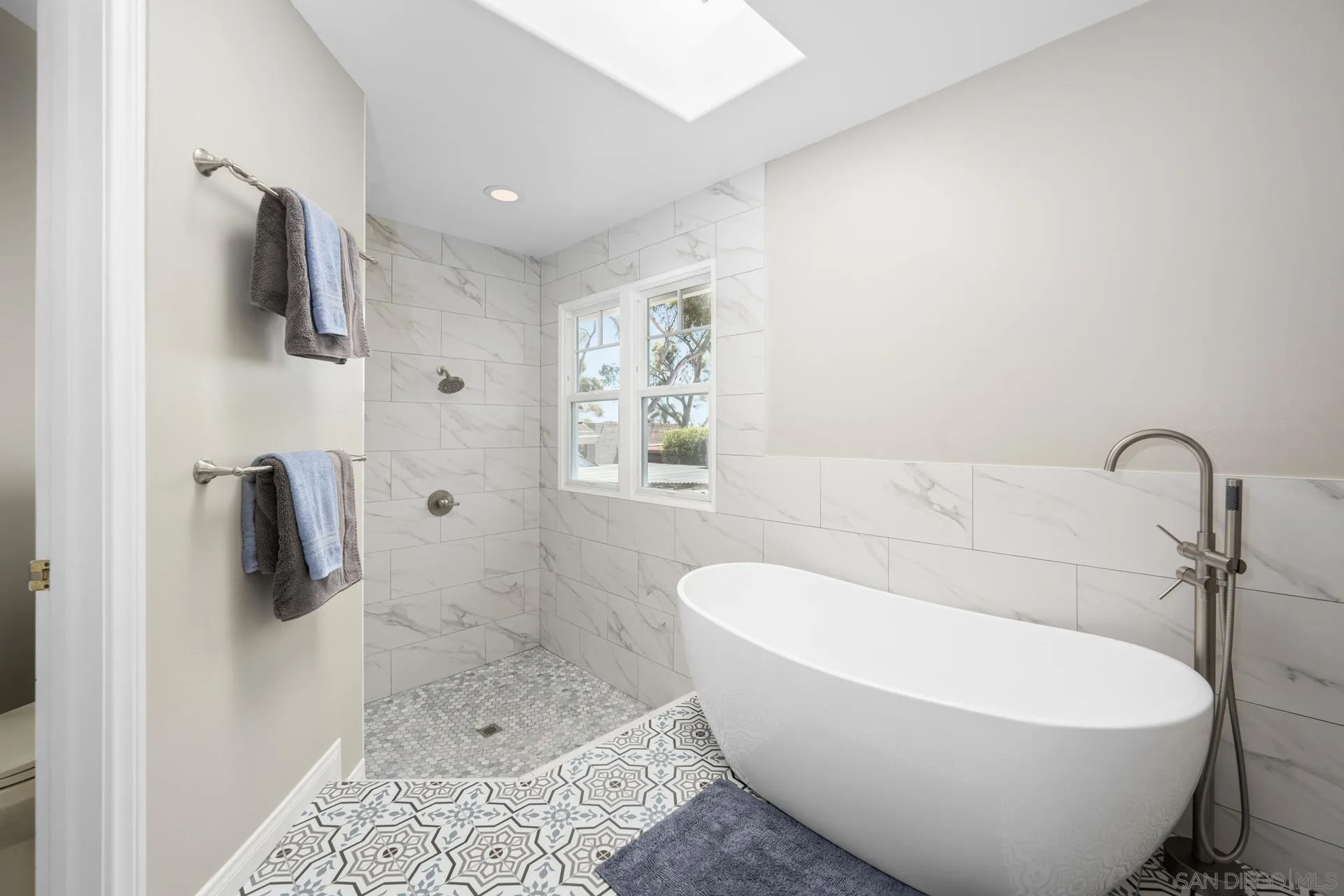 3733 La Cresta Drive San Diego, CA 92107 - Photo 33 of 57 a white bath tub sitting next to a bathroom