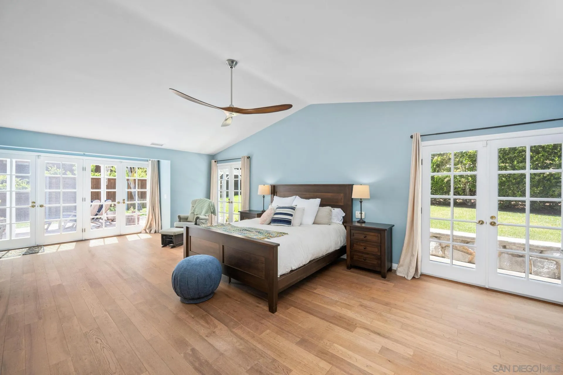 3733 La Cresta Drive San Diego, CA 92107 - Photo 37 of 57 a spacious bedroom with a bed couch and a large window with outer view