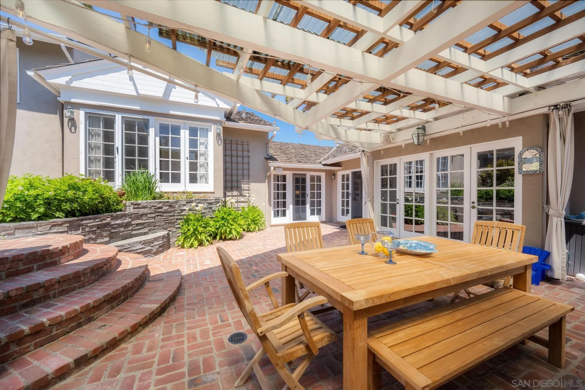3733 La Cresta Drive San Diego, CA 92107 - Photo 42 of 57 a view of a patio with a table and chairs