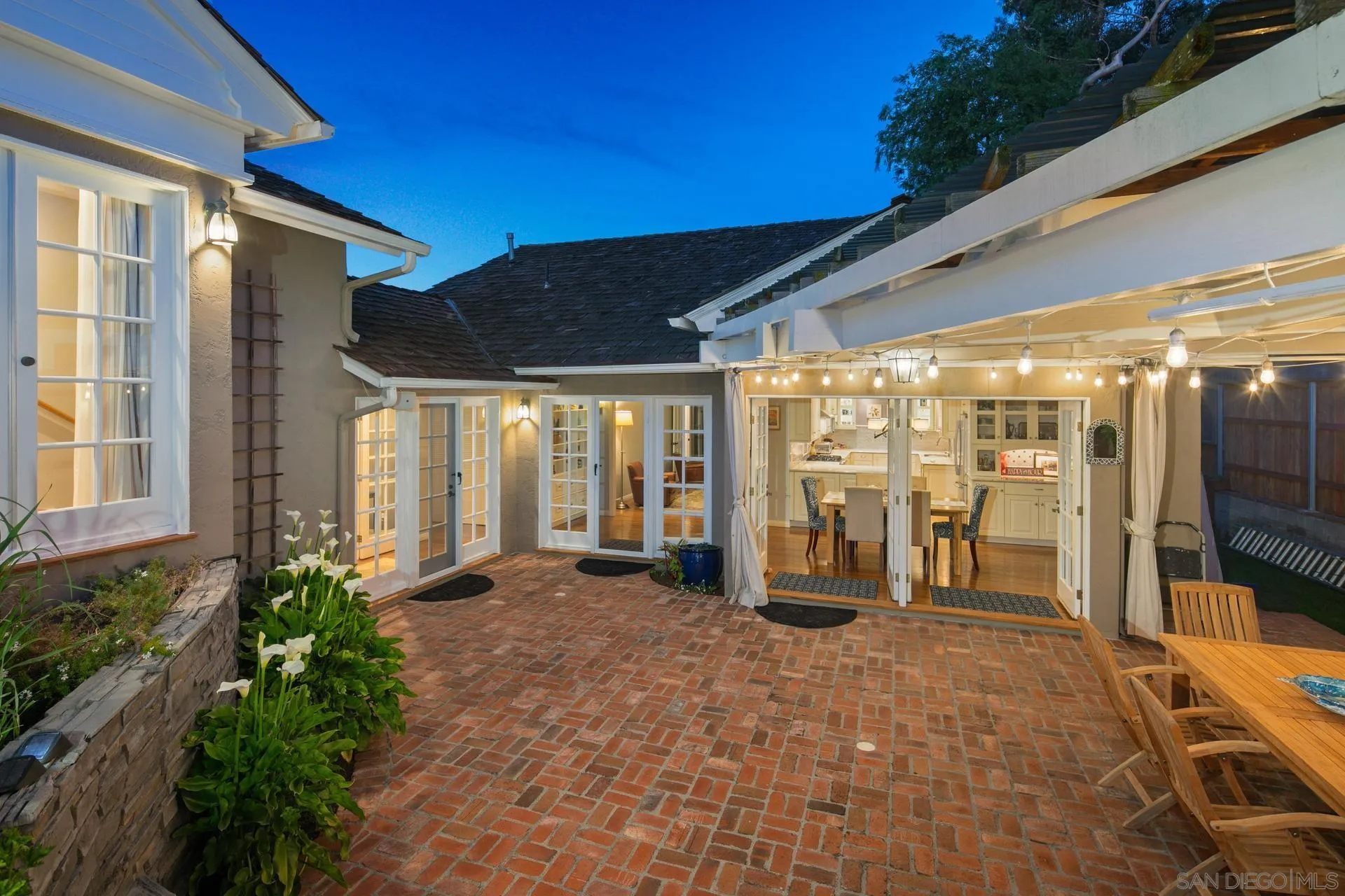 3733 La Cresta Drive San Diego, CA 92107 - Photo 49 of 57 a view of a porch with a table and chairs