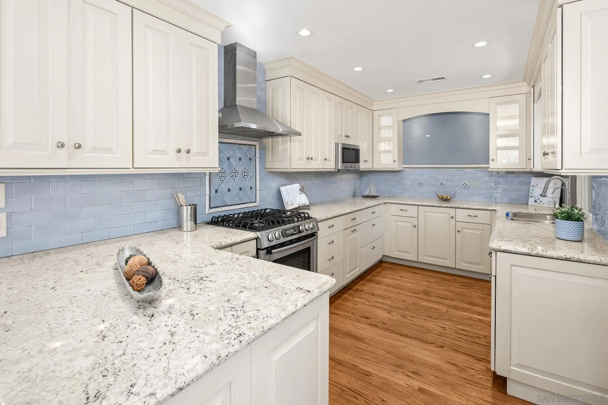 3733 La Cresta Drive San Diego, CA 92107 - Photo 10 of 57 a kitchen with stainless steel appliances granite countertop a sink stove and refrigerator