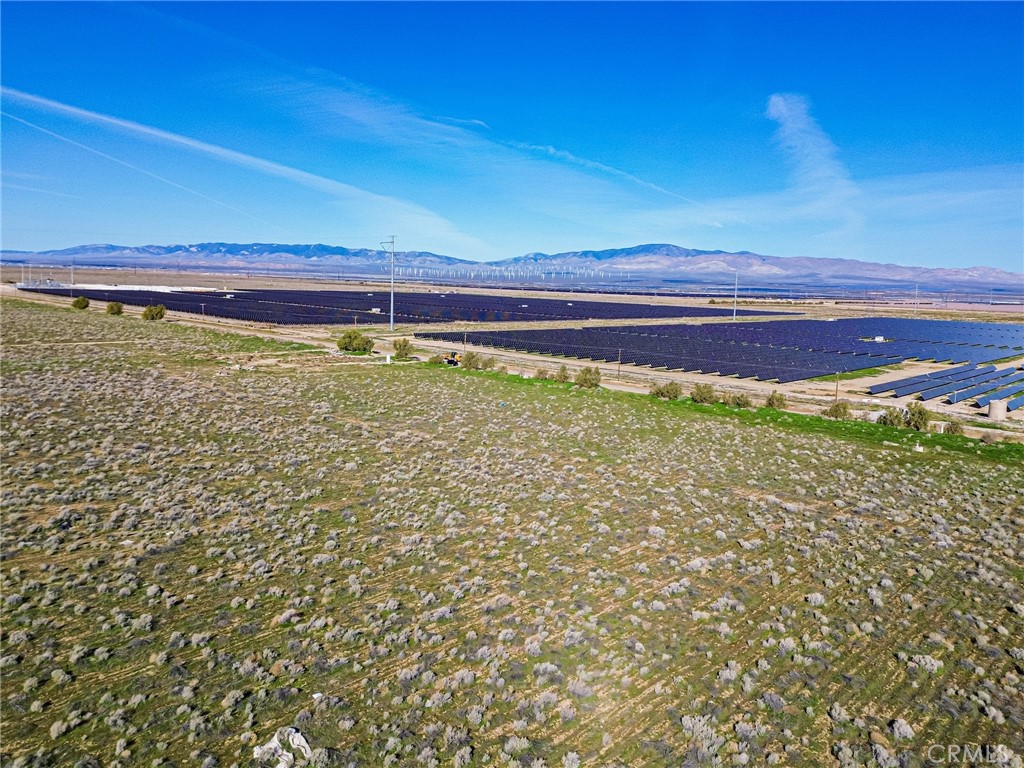 10400 West Ave B Lancaster, CA 93536 - Photo 9 of 43 a view of a large pool with an outdoor space and seating area
