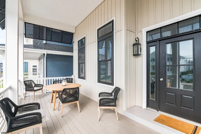 a outdoor space with patio the couches and a dining table with the balcony view
