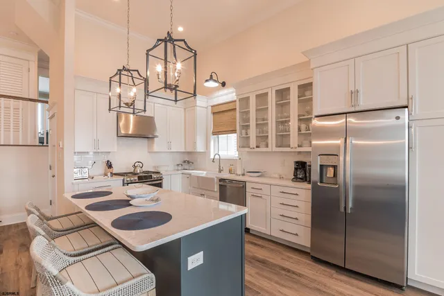 a kitchen with a sink stove and refrigerator