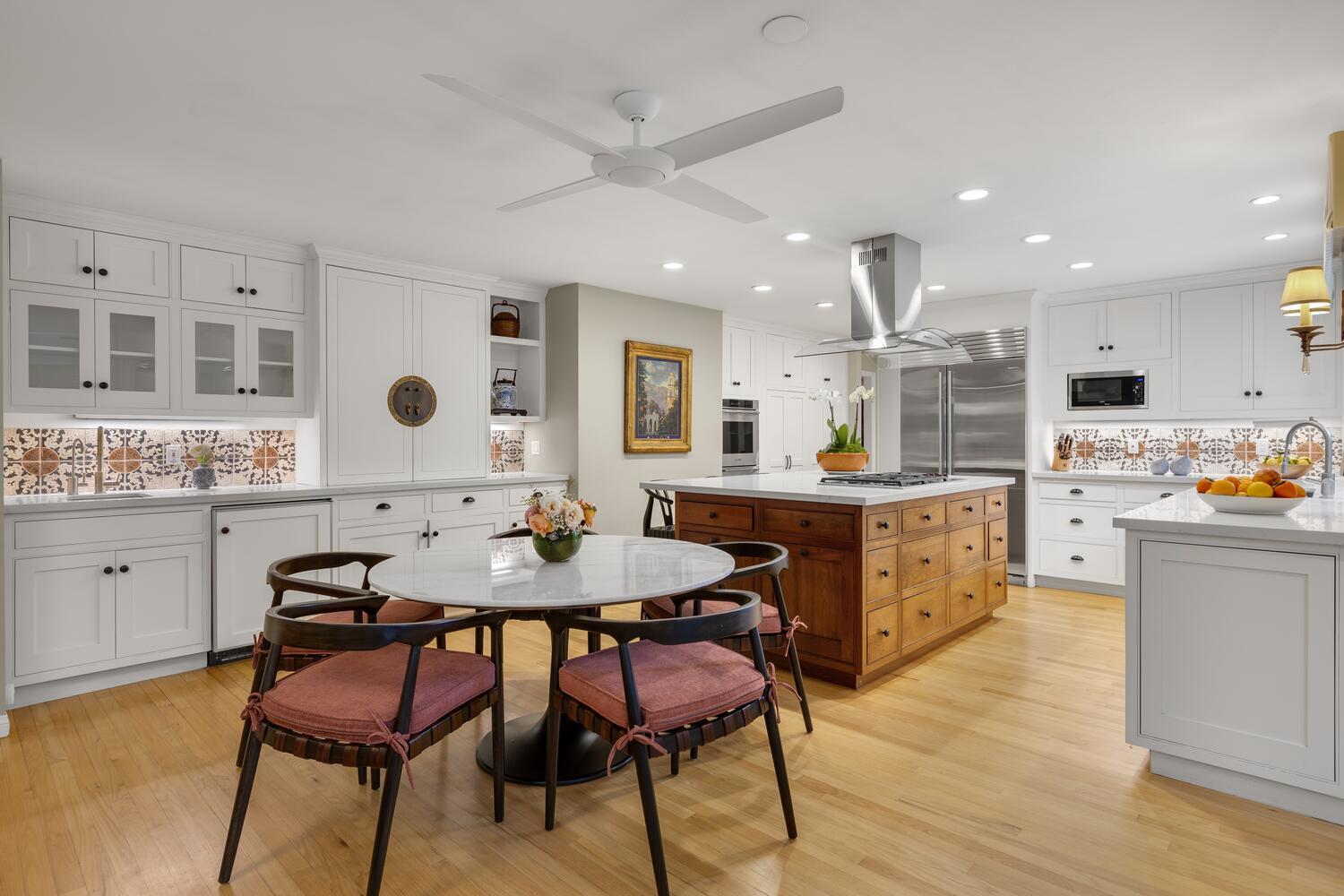 828 Foothill Lane Ojai, CA 93023 - Photo 12 of 40 a kitchen with stainless steel appliances kitchen island granite countertop a table chairs and a refrigerator