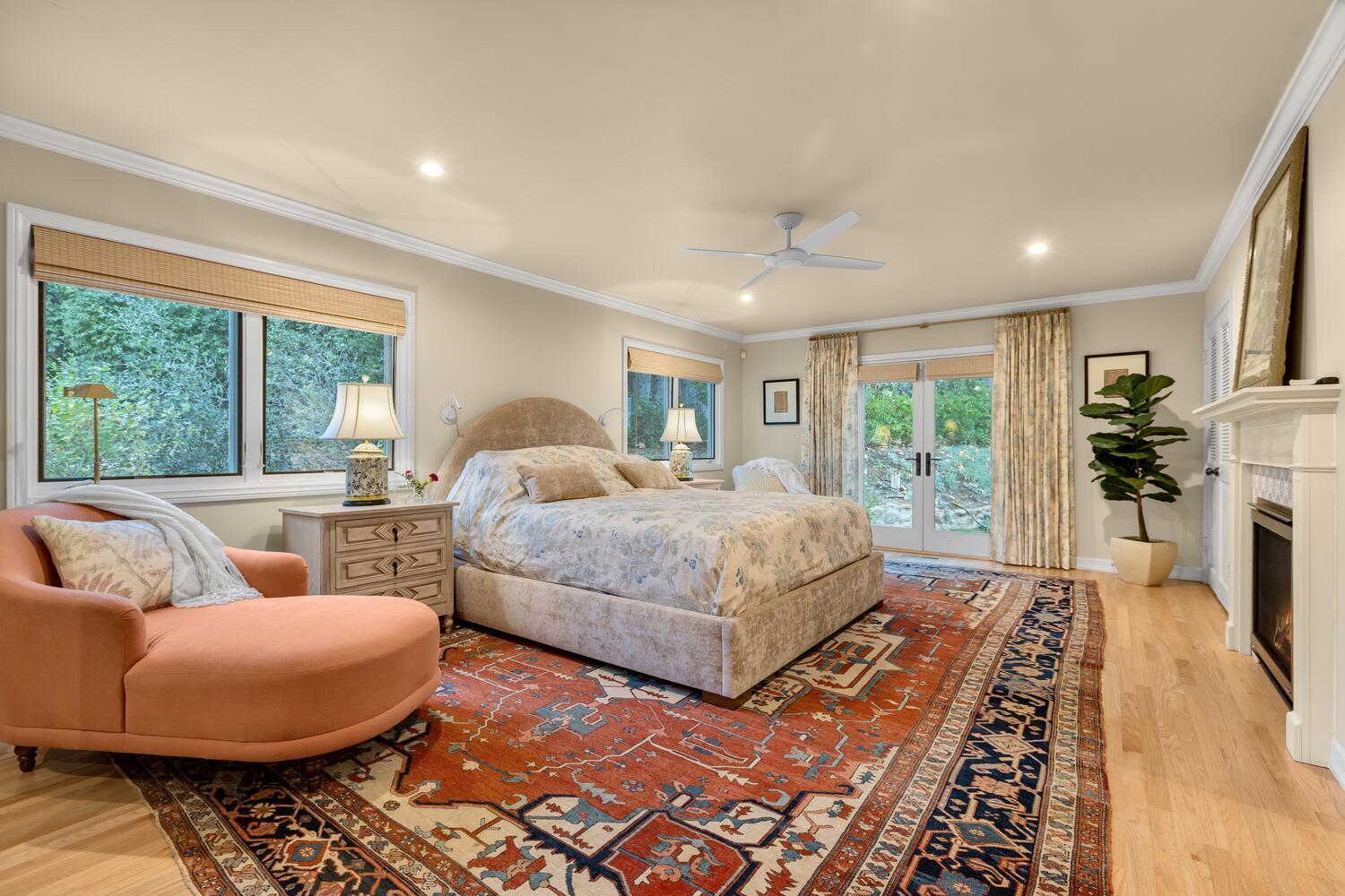 828 Foothill Lane Ojai, CA 93023 - Photo 15 of 40 a bedroom with a bed a couch and large windows