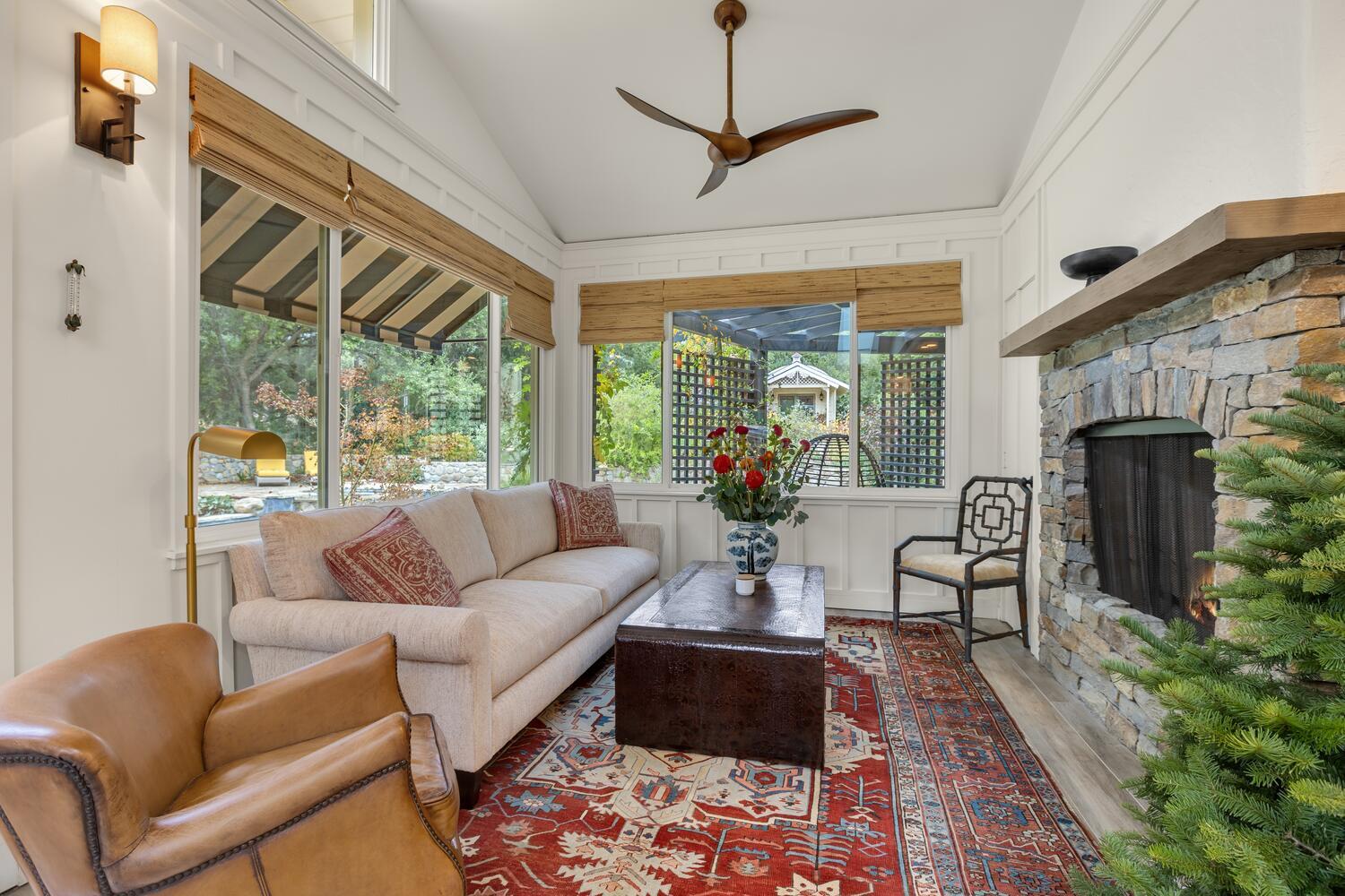 828 Foothill Lane Ojai, CA 93023 - Photo 25 of 40 a living room with furniture fireplace and a large window