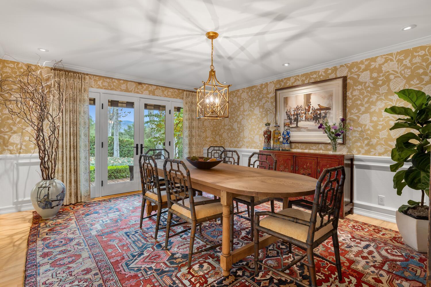 828 Foothill Lane Ojai, CA 93023 - Photo 8 of 40 a dining room with furniture a chandelier and wooden floor