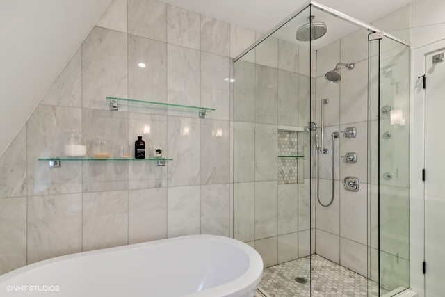 2708 West Nelson Street Chicago, IL 60618 - Photo 11 of 26 a bathroom with a bathtub and shower
