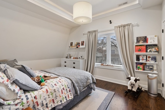 2708 West Nelson Street Chicago, IL 60618 - Photo 12 of 26 a bedroom with a bed and a window