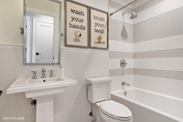 2708 West Nelson Street Chicago, IL 60618 - Photo 14 of 26 a bathroom with a sink toilet and shower