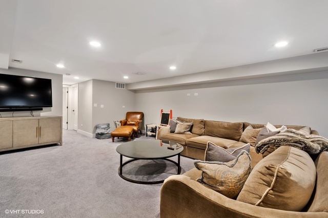 2708 West Nelson Street Chicago, IL 60618 - Photo 19 of 26 a living room with furniture and a flat screen tv