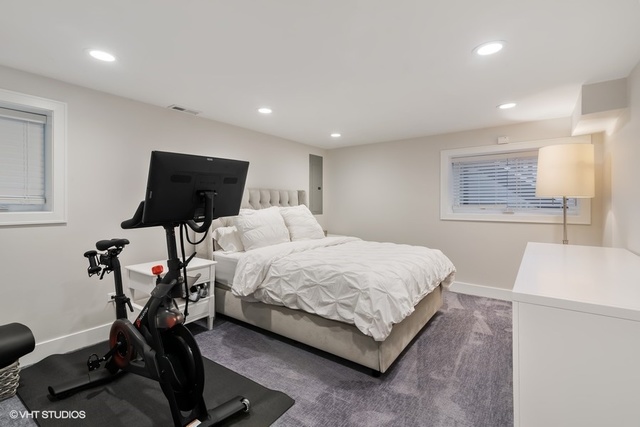 2708 West Nelson Street Chicago, IL 60618 - Photo 20 of 26 a bedroom with a bed and a chair