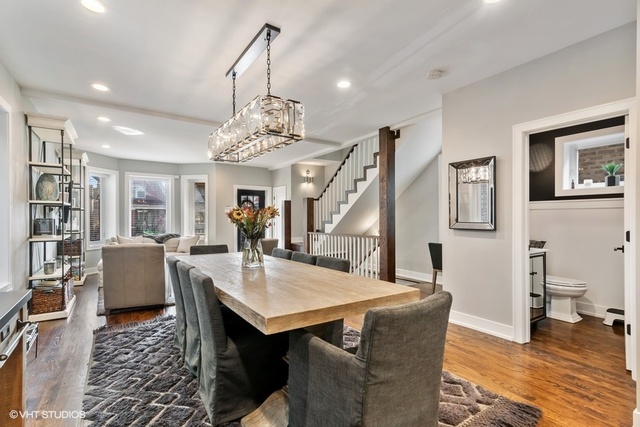 2708 West Nelson Street Chicago, IL 60618 - Photo 3 of 26 a living room with furniture and a chandelier