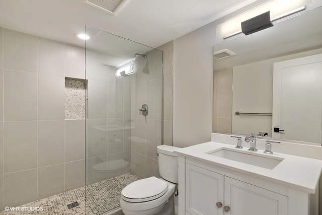 2708 West Nelson Street Chicago, IL 60618 - Photo 21 of 26 a bathroom with a sink a toilet and shower