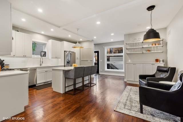 2708 West Nelson Street Chicago, IL 60618 - Photo 5 of 26 a kitchen with white cabinets and appliances