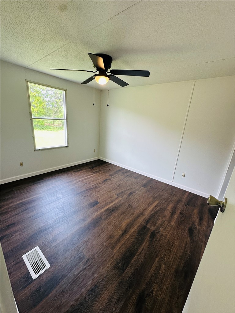 134 Arabian Way Anderson, SC 29626 - Photo 15 of 23 This inviting bedroom features rich hardwood flooring and a refreshing ceiling fan for comfort.