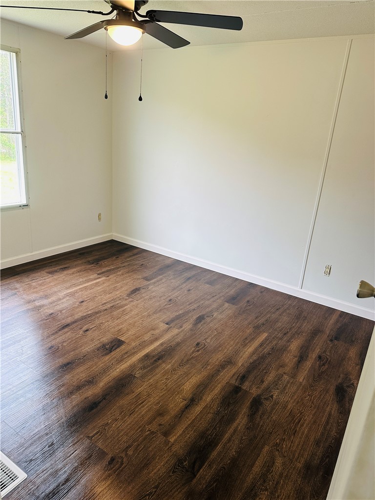 134 Arabian Way Anderson, SC 29626 - Photo 21 of 23 This inviting bedroom features rich wood flooring and abundant natural light.