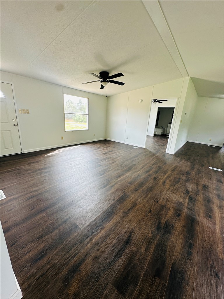 134 Arabian Way Anderson, SC 29626 - Photo 7 of 23 This bright living area features rich wood flooring, creating a warm and inviting atmosphere.