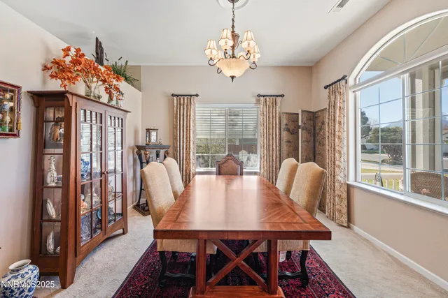 a living room with furniture fireplace and window