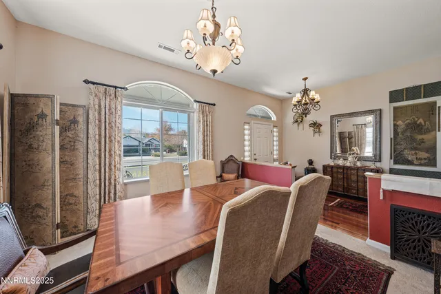 a living room with furniture a rug and a fireplace