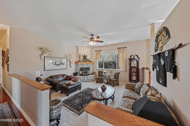 a view of a dining room with furniture wooden floor and chandelier