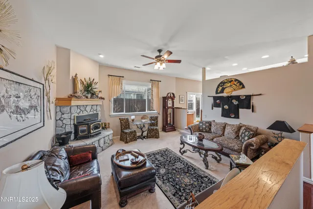 a dining room with wooden floor and chandelier
