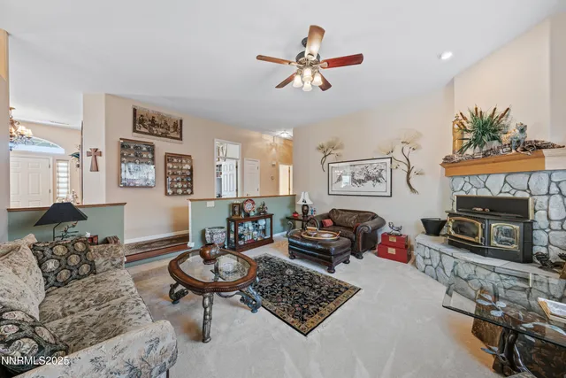 a kitchen with granite countertop a refrigerator and a stove top oven