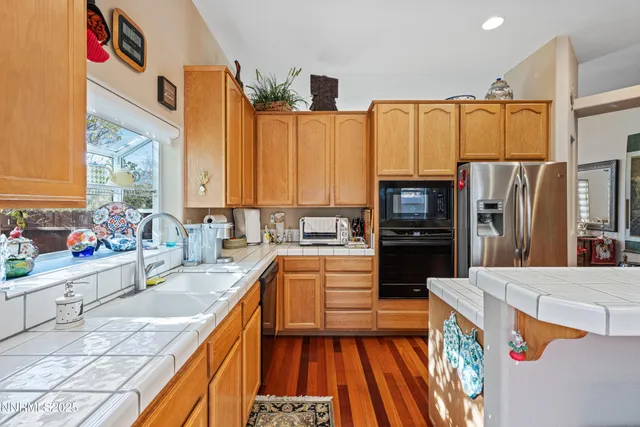 a bathroom with a sink a toilet and shower curtain