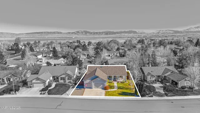 an aerial view of residential houses with outdoor space