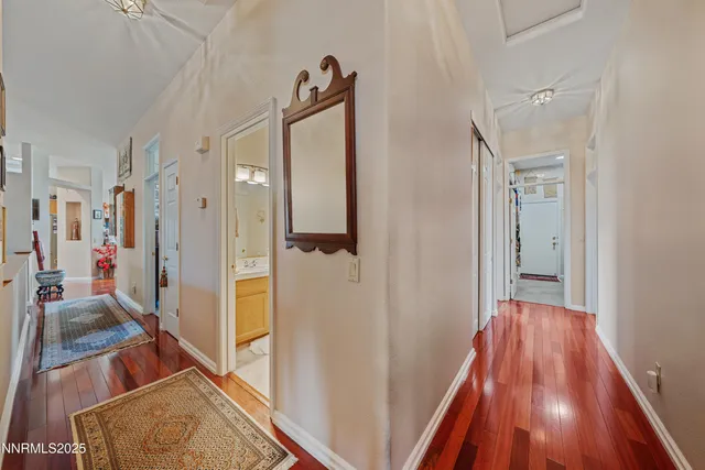 a bathroom with a sink double vanity granite and a mirror