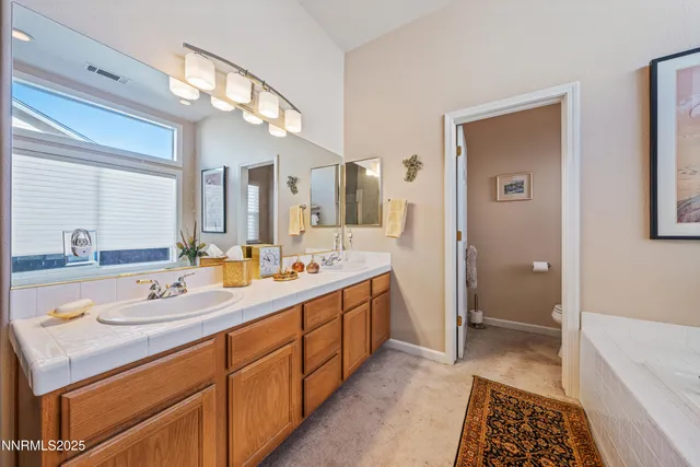 a bedroom with two beds and a dresser in it