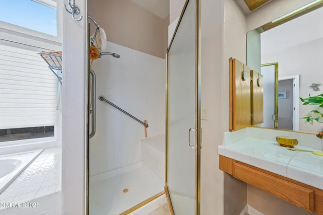 a living room with furniture a ceiling fan and a window