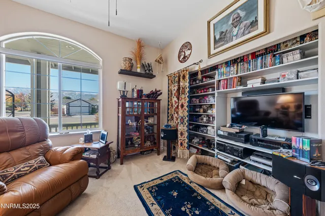 a view of house with a big yard and large trees