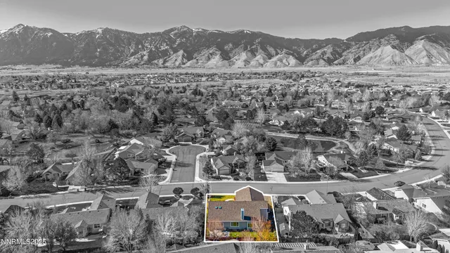 a view of a dining room with furniture a chandelier and wooden floor