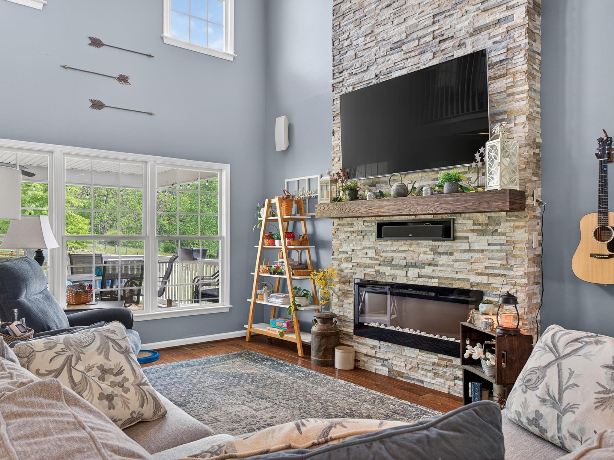 235 Howardsville Road Staunton, VA 24401 - Photo 13 of 48 a living room with fireplace furniture and a flat screen tv