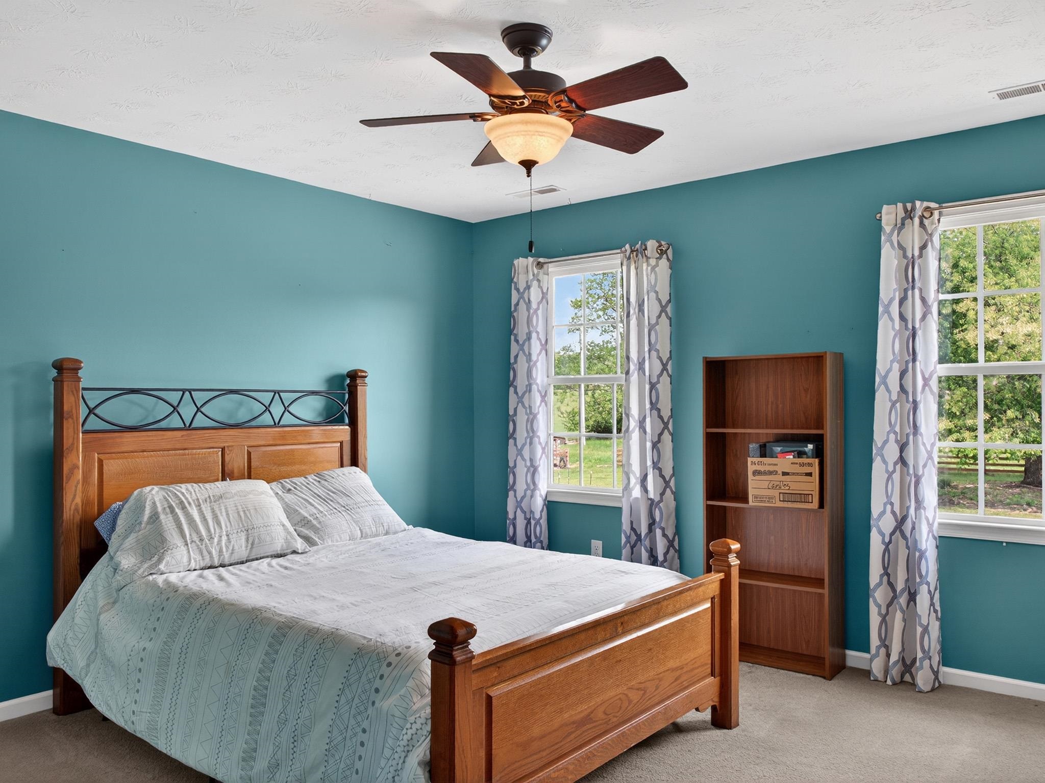235 Howardsville Road Staunton, VA 24401 - Photo 22 of 48 a bed sitting in a bedroom next to a window