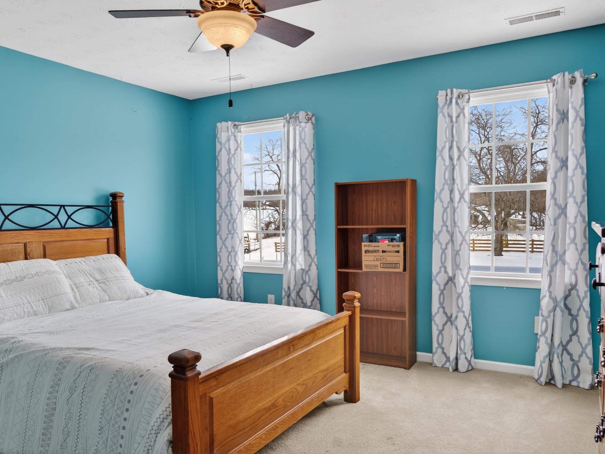 235 Howardsville Road Staunton, VA 24401 - Photo 28 of 51 a bedroom with a bed and a chandelier